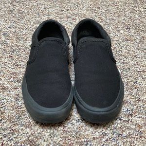 Vans all black slip ons